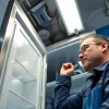 Skilled technician performing walk in freezer repair in a commercial kitchen, ensuring optimal operation.