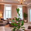 Experience the cozy ambiance and elegant interior of Bloomsbury Residences with stylish furnishings and warm lighting.