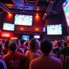 Excited fans enjoying a live football match at a sports bar while using the เว็บดูบอล platform for seamless viewing.