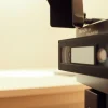 Convert MiniDV to digital, showcasing the MiniDV tape alongside modern conversion equipment.