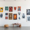 Showcase vibrant posters and prints adorning a modern living space to inspire creativity.