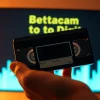 Convert Betacam to Digital with detailed visuals of a Betacam tape being handled before digitization.