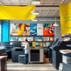 Showcasing printers Edmonton Alberta in a professional printing shop with colorful displays.