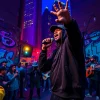 Artists captivating the audience with underground rap Chicago performance under neon lights.