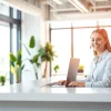 Enhance your business with our Virtual Answer Service featuring a friendly receptionist at work.