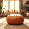 Showcase unique Moroccan leather poufs and ottomans from http://labboho.com/collections/leather-poufs-ottomans in a cozy living room.