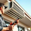 Professional HVAC technician assessing air conditioning unit in Los Angeles HVAC services.