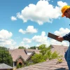 Best roofing company in Austin showcasing a professional contractor inspecting rooftops for quality.