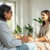Empathetic attachment theory specialist guiding a client in therapy for emotional healing.