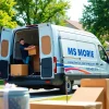 Showcasing a man and van moving service expertly loading furniture and boxes, emphasizing professionalism.