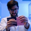 Scientist conducting an all check on TeSR™ feeder-free pluripotent stem cell culture media for quality assurance.