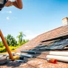Leakage Repair Roof Specialist Singapore inspecting roof damage with tools.