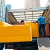 Efficient movers from https://starvanlinesmovers.com professionally loading furniture into a moving truck.