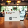 Showcase impactful Google reviews card from https://www.reviewcardsgoogle.com on a wooden table inviting customer feedback.