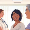 Professional interaction showcasing the Alabama Board of Nursing's commitment to healthcare standards.