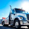Towing Service in Toronto with a reliable tow truck against the city skyline, symbolizing speed and expertise.