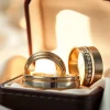 Showcasing exquisite wedding bands for men in a luxurious setting with detailed designs.