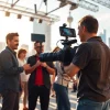 Engaging scene of Creative Video Shoots Toronto with a videographer capturing team collaboration.