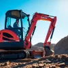 Operate a Kubota excavator showcasing its performance on a job site.