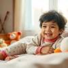 Child enjoying comfortable Bamboo kids pajamas on a cozy bed surrounded by toys.
