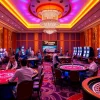 Experience the excitement at TPower casino with vibrant gaming tables and enthusiastic players.