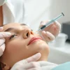 Administering cosmetic fillers in a serene clinic environment showcasing smooth skin texture.