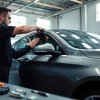 Experience high-quality car window tinting with professionals in action.