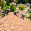 Roof Repair Vancouver Wa team fixing a residential roof in a vibrant neighborhood.