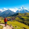 Embarking on the Manaslu Circuit Trek with breathtaking views of snow-capped mountains and vibrant valleys.