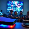 Experience the excitement of PS5 games with group gameplay in a vibrant gaming room setting.