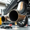Install a high-performance downpipe showcasing its gleaming features in an automotive garage setting.