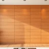 Showcase woodveneerhub through striking warm wood paneling in a modern living room setting.