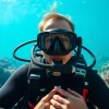 Embark on a Padi dive course with a professional scuba diver at a vibrant coral reef.