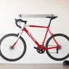 Secure the bike with a stylish Bicycle wall hanger mounted on a minimalist wall.
