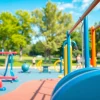 Engaging outdoor gym equipment set in a park environment with accessible fitness stations.